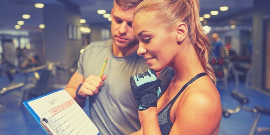 Girl talking to personal trainer